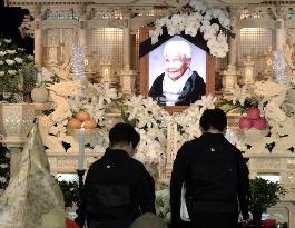 100 mourners pay respects to centenarian twin Gin-san